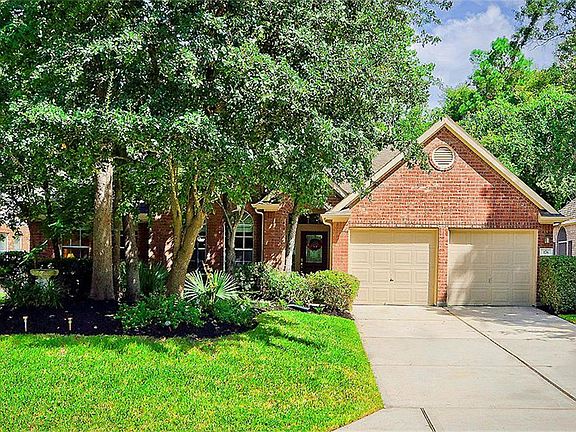 The treed front yard provides a shady view from the front rooms.