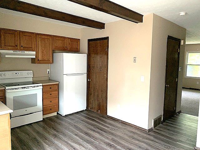 Kitchen with new vinyl flooring and pantry