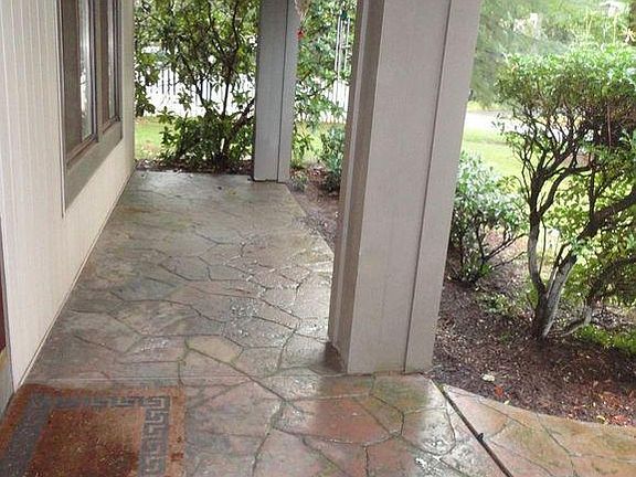 Front door entrance (entrance door is not visible on the left of the doormat)