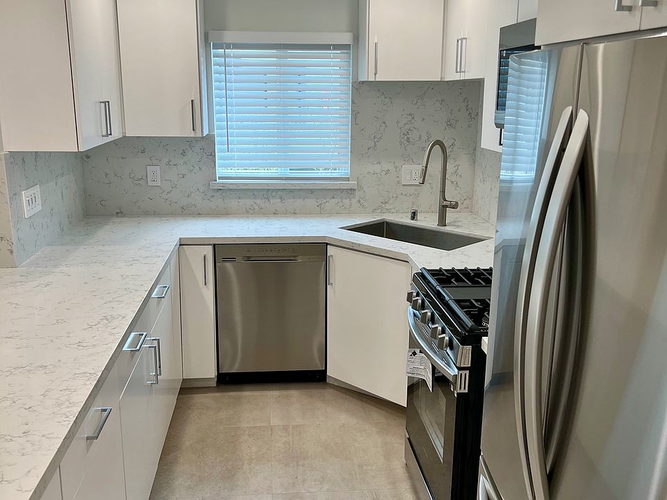 Beautifully Upgraded and Remodeled Kitchen with Stone Counters, Stainless Steel Appliances and Custom Cabinets