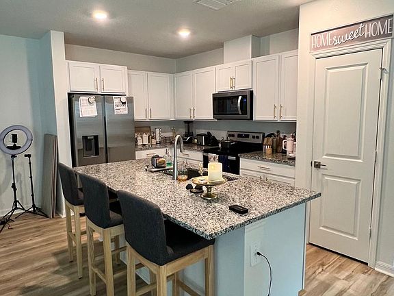 Kitchen view. Granite counter top.