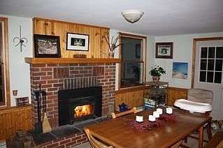 View of kitchen fireplace. 