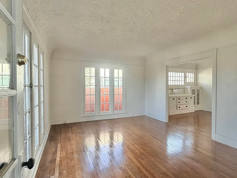 View from front door through living room into dining area