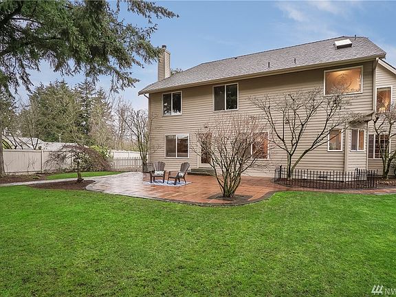 Spacious backyard is fully fenced, has an over-sized paver patio, an extra wide side-yard for dog run or RV.  RV requires HOA approval.