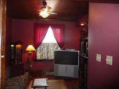 living room with wood paneled ceiling