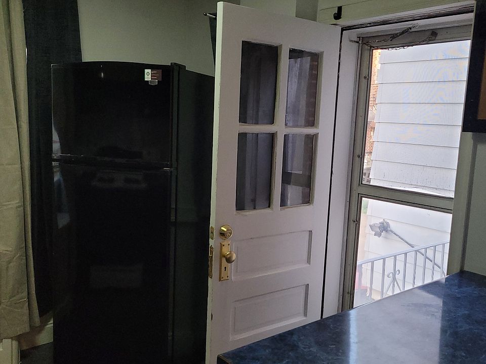 Kitchen leading to small balcony