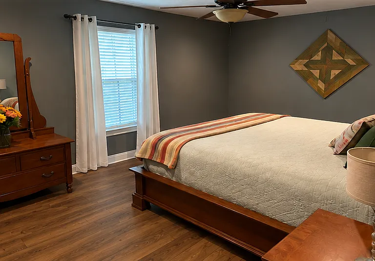 AI adjusted photo to show the upgrade to LVP flooring. NO carpet in the house.