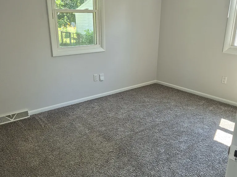 One of three bedrooms