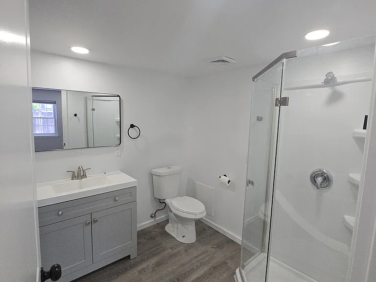 Master bathroom with stand up shower, dual flush toilet
