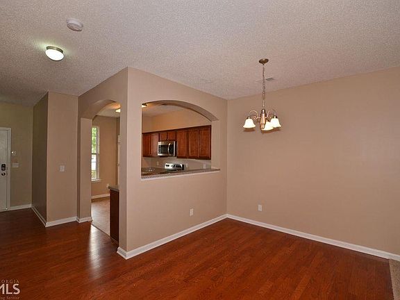 The kitchen is open to the dining and living areas for easy conversation.
