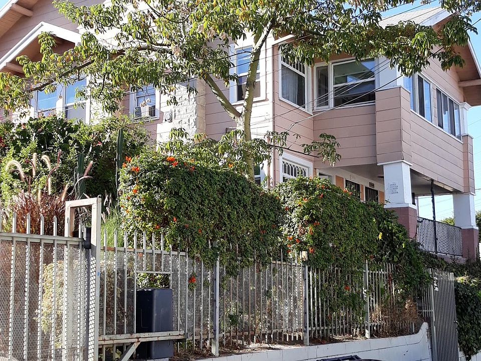 Front of apartment building. There is a total of 4 units in the building and the one that is available is on the first floor.