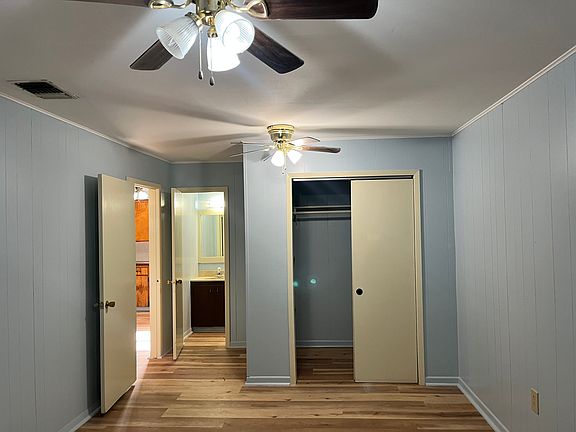 Primary bedroom with an attached bathroom
