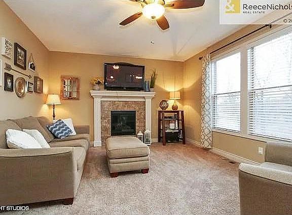 Fireplace in the great room with enough windows to keep it light and bright. Large enough for large gatherings, yet just right for those intimate evenings