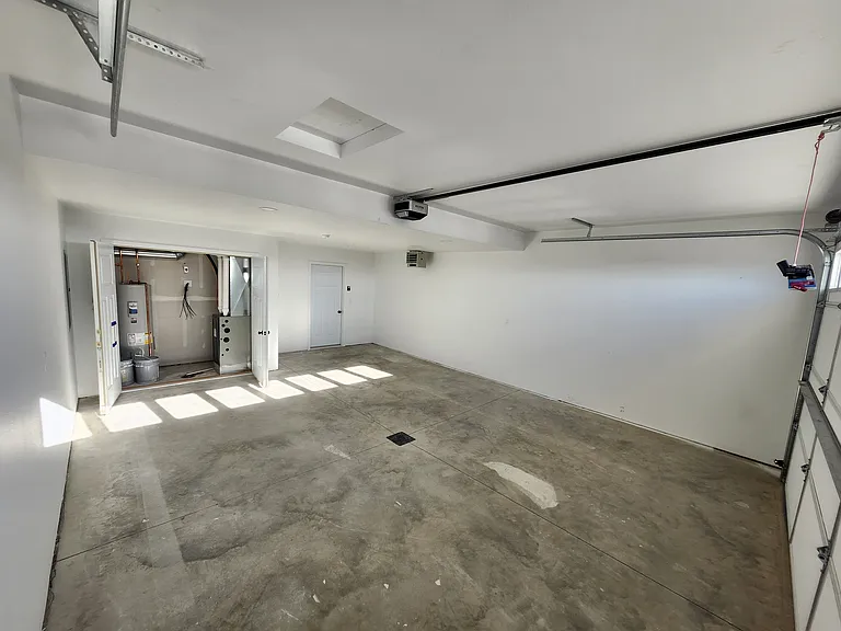 Heated two stall garage. (Pictures are of another unit with similar finishes and features.)