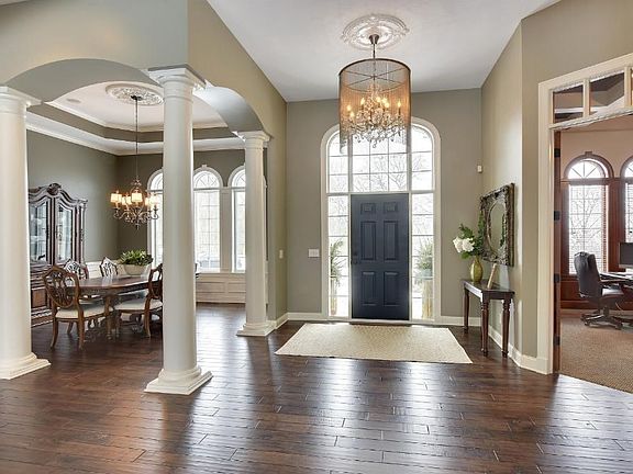 Notice the stunning chandelier, it is chic and modern and gives the room a high end feel right away.