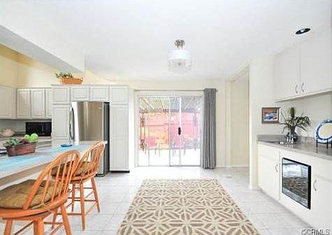 Wet bar on the right with a wine refrigerator.