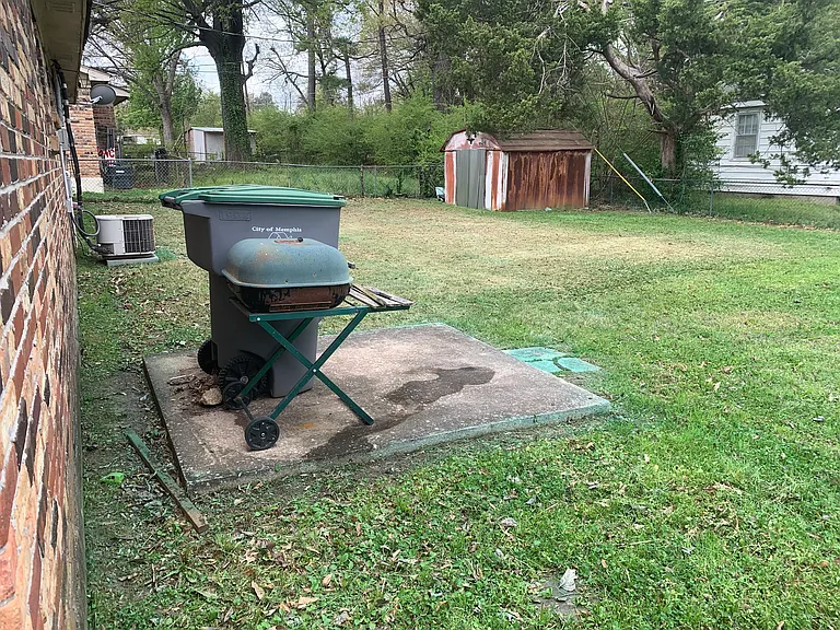 Backyard with small patio and bbq grill
