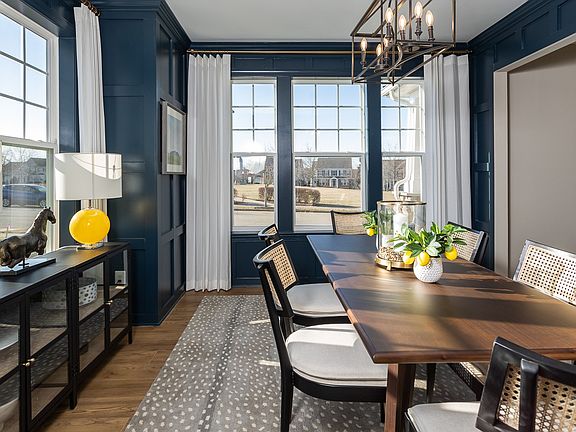 Dining room with 2 walls of windows at a DRB Homes Clemson model at the Huntfield community.