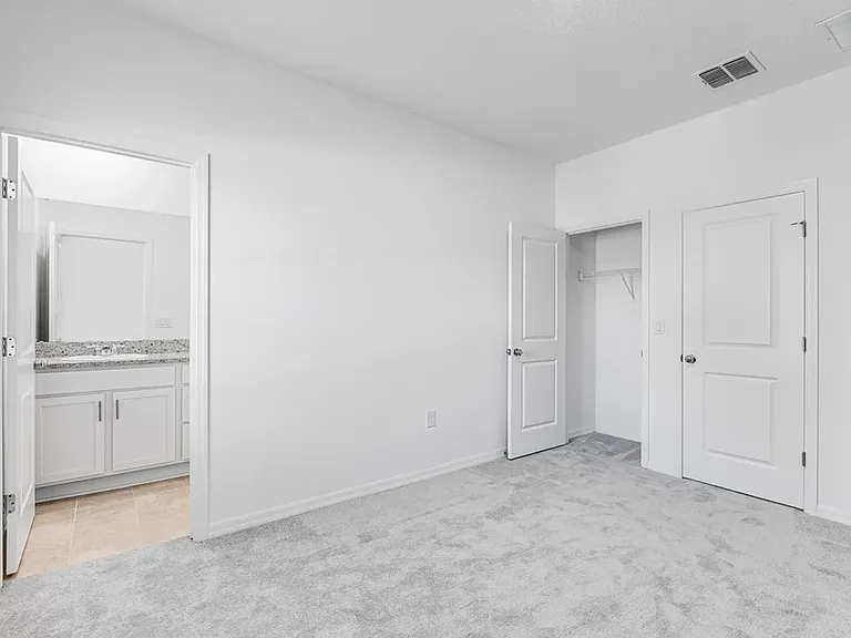 Bedroom with private bathroom and 2 closets