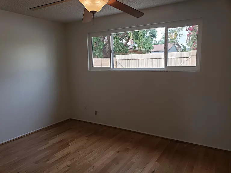 A nice view of the private light bright window of the bedroom