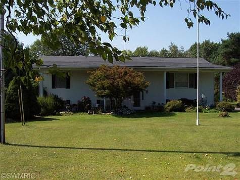This colonial style home has a lot to offer sitting on about 18  wooded acres with a pond, There are 4 bedrooms, 3 bathrooms, spacious kitchen, living room and formal dining area, sliders leading you onto a very large deck from the dining area, the family room is tiled with a wood stove and sliders to a patio, This home has had a few up grades the past 7 years,a roof,a well, some windows. The pole barn is about 20x40,there is a paved drive-way, central vacuum. corner lot boarders 2 roads, Diamond and Lakeside, Derby lake is about a block away. This is a must see home, call Sharon today, for your private showing