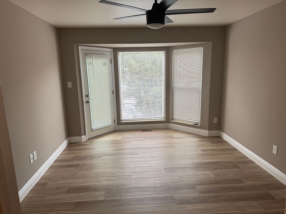 Main floor master bedroom with new flooring, windows and door that walks out to deck.