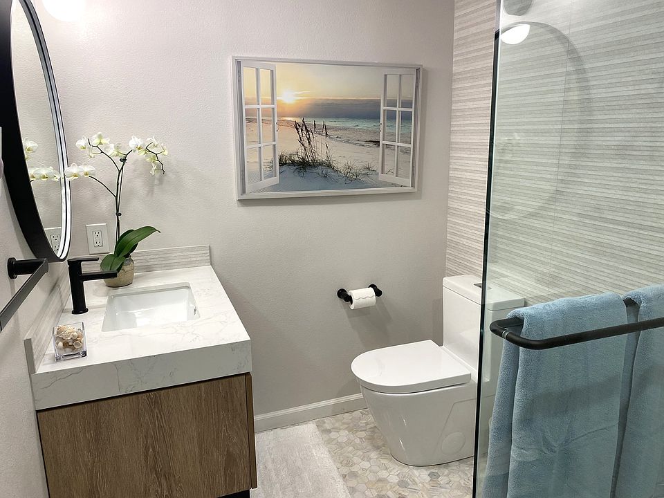porcelain tile floors, all glass shower doors and three different lights
