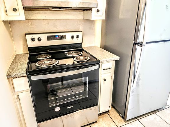 new stainless steel stove and refrigerator