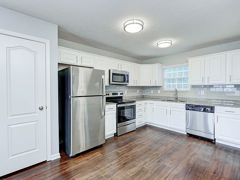 Clean lines and modern finishes bring new life to this updated kitchen_complete with sleek cabinetry and stainless steel appliances.