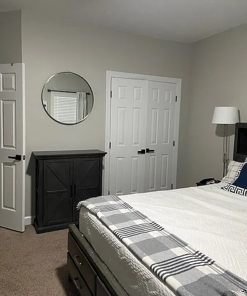 Additional storage with mirror above. Full closet supplied with hangers and laundry baskets.