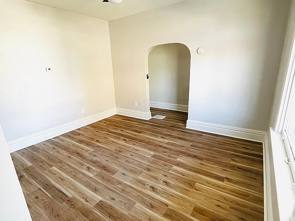 Living room view facing hallway entryway