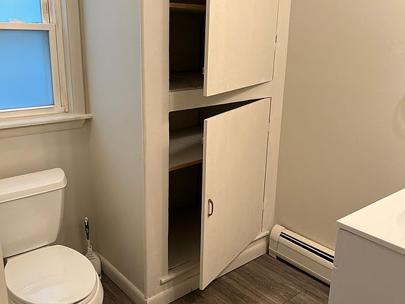 First floor half bath with storage.