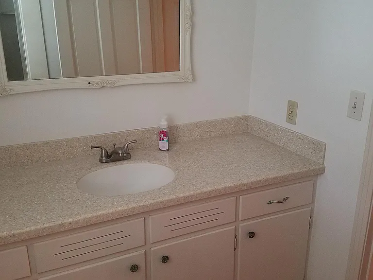 Bath 2 with update fixtures and countertops.