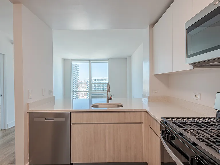 Sleek stainless steel appliances and modern cabinetry