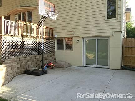 Walkout basement with large cement patio and new stone retaining wall.