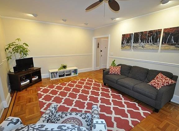 Large Living Room overlooking Garth Woods and the buildings patio.  The living room has recess lighting, chair rail and refinished parquet floors.  The room is 23'-0" x 14'-0".