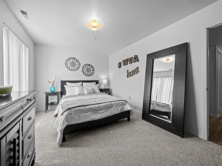 Big bedroom with natural lighting at Westwood Village Apartments in Westland, MI