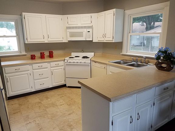 Kitchen has dishwasher and built in microwave.