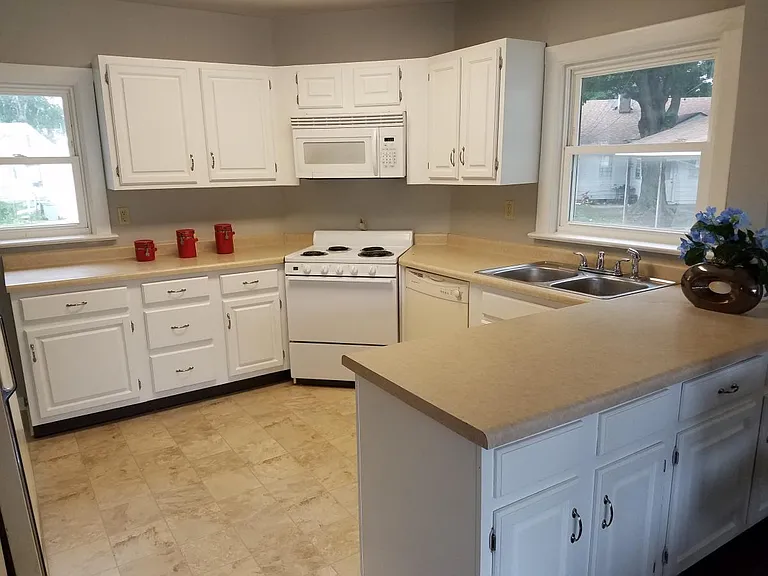 Kitchen has dishwasher and built in microwave.