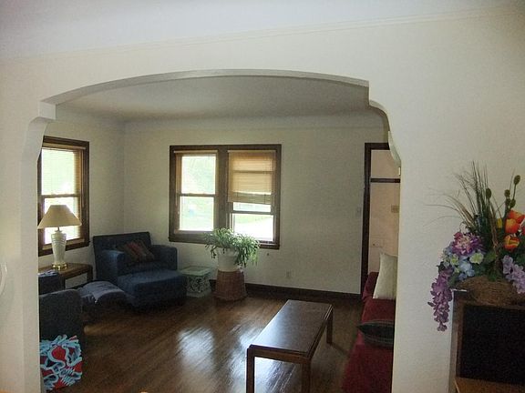 Living Room with Arch and built in shelves