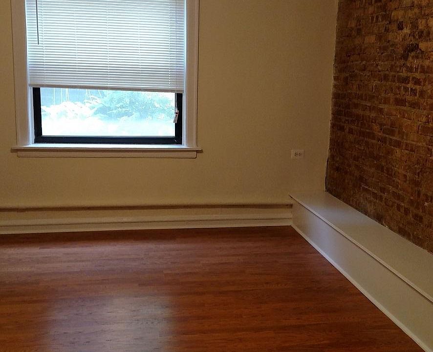 Living room with exposed brick wall