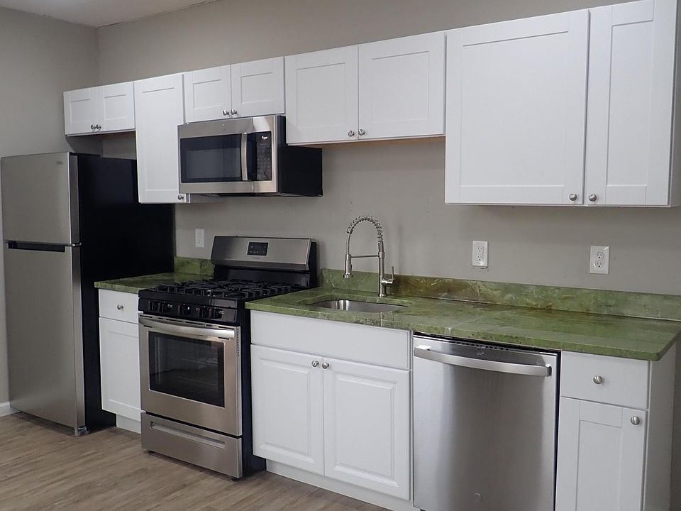 Kitchen with stainless steel appliances and granite countertop