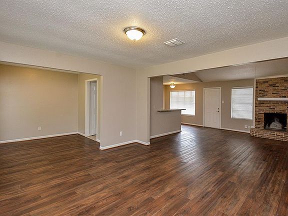 Wonderful open floorplan with wood vinyl flooring throughout main living space.