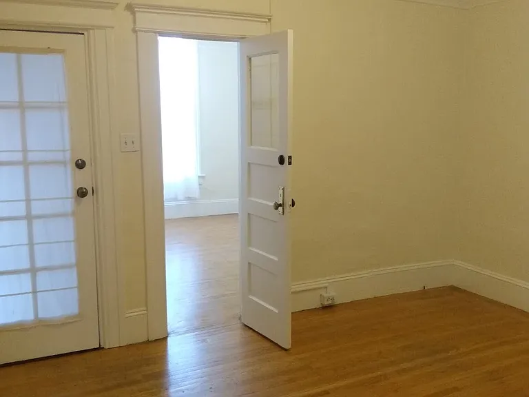 From living room into front room to room/office
