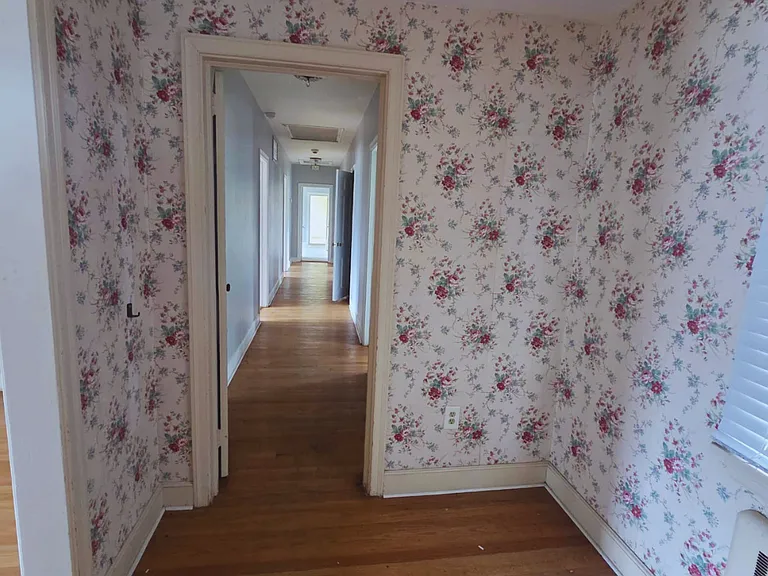 Floral-inspired bedroom designed for comfort and relaxation.
