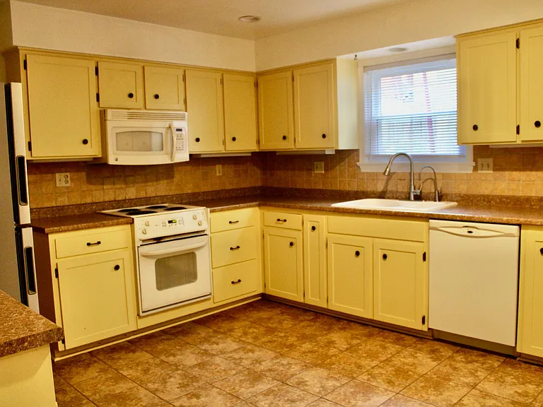 Large kitchen with tile flooring