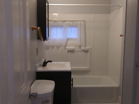 remodeled bathroom with linen closet