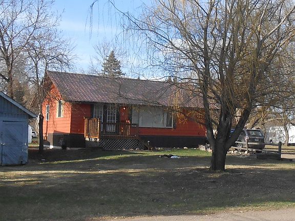 Natural gas furnace, city water/sewer, all utilities included. The barn to the left is the west property boundary.