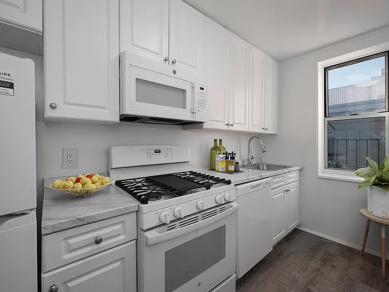 Step into the modern charm of 40 Barker Avenue, where a sleek kitchen awaits you. With contemporary finishes, ample storage, and stylish appliances, it's the perfect space for culinary creativity. Explore your future home today!