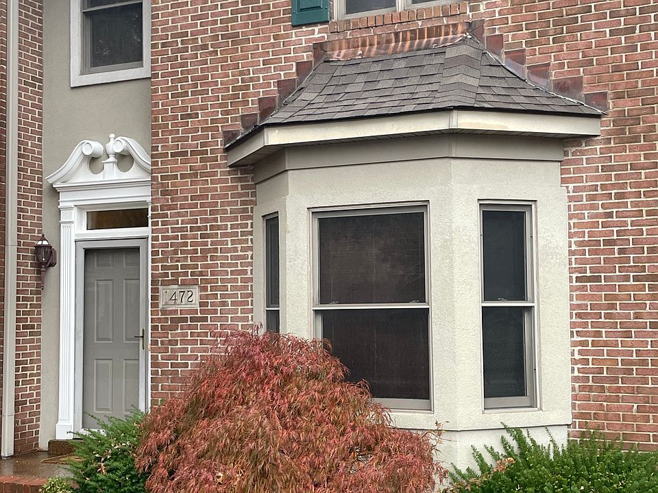 Front entry with side lights and copper roof accent